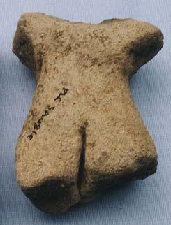 The torso wears a simple pubic flap. The flap is a rounded rectangular shape with vertical striations on it, perhaps to suggest that it is a woven piece of garment.