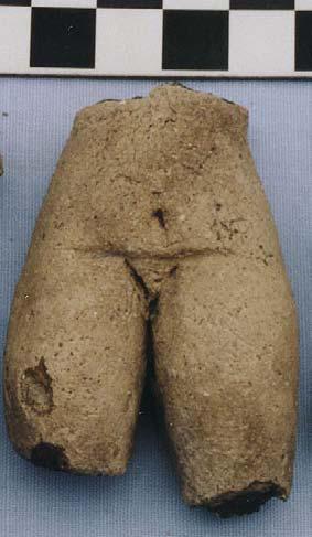 Figurine T-25 (picture not available) is from Unit 8, Level 7 (PLCSAU8/7, FS# 367). The figurine is a torso fragment of the chest and abdominal area. The shoulders, hips, and limbs are absent.