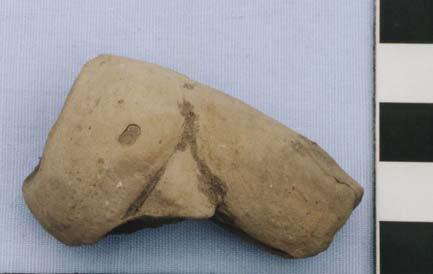 Figurine T-34 (picture not available) is a fragment of an upper torso. It was found from the Unit 7 feasting refuse (FS# 816). Its crude construction makes the gender difficult to determine.