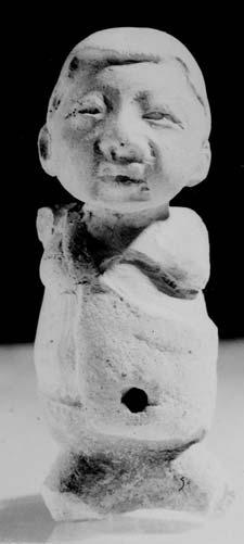 1999:Figure 20), c) Female figurine with central part