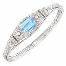 $3,000-4,000 237 White Gold and Aquamarine Ring 18 kt., one oval aquamarine ap. 12.00 cts., ap. 4.7 dwts. Size 5. Estate of an Encino Lady 244 Platinum and Diamond Band Ring 19 round diamonds ap. 2.85 cts.