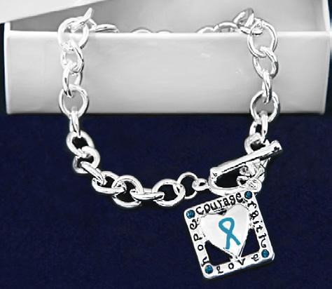 White costume pearl beads with sterling silver plated charms that have teal ribbons. Comes in optional gift box.