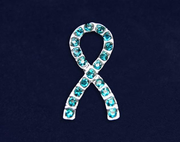 This sterling silver plated pin is a ribbon with teal crystals.