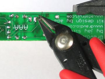 Flip over the PCB and solder it in. Then clip the leads.