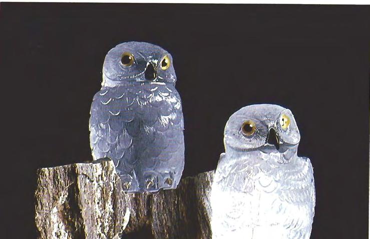 Figure 2. This pair of rock crystal owls on a petrified wood base is typical of the con temporary animal carvings displayed in the museum.