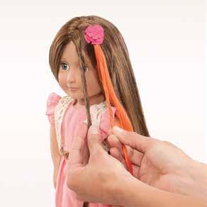 Clip hair extension near the root and divide hair into two