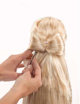 Secure hair at top of the bow with bobby pins.