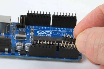 Insert the Headers into an Arduino To align the header strips for soldering, insert
