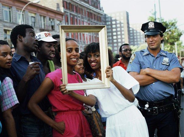 Art Is... (Woman with Man and Cop Watching), 1983/2009. Chromogenic color print, 16 x 20 in. Courtesy Alexander Gray Associates, New York. 2015 Lorraine O Grady/Artist Rights Society (ARS), New York.