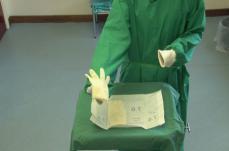 gown The sterile glove wrapper should not be touched