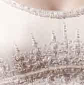 The corseted bodice elongates the waist and is adorned with Swarovski crystals, pearls and hand-beaded embroidery.