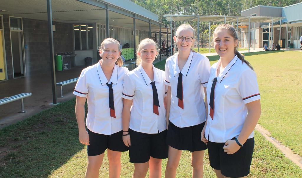 Senior Years - Year 10 to Year 12 Girls EVERYDAY DRESS (MONDAY TO THURSDAY) Blouse White poly/cotton panel style blouse with curved hem, peak colour with navy piping trim, and navy/brick sleeve trim.