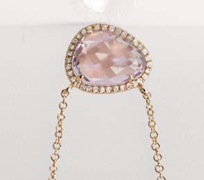 00 B] 14kt rose gold pendant with a single bezel set faceted fancy cut pink