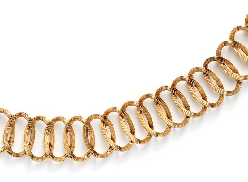 299 18kt Gold Belt, Tiffany & Co., Germany, c. 1970s, of gadrooned oval links, 160.7 dwt, lg. 34 in., signed. $8,000-10,000 301 18kt Gold and Hardstone Bracelet, Tiffany & Co.