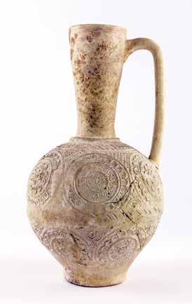 Islamic Collection D. 15766 112. MOLDED VESSEL Baked clay (with modern restoration) Iran, Istakhr, GI15, shops on the mosque plaza Excavated under the direction of Erich F.