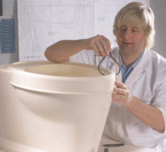 The finest china clay is taken from the mould and lovingly smoothed by hand before firing.
