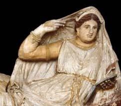 400 years after the terra cotta couple Much more Roman like She is depicted reclining upon a mattress and pillow, holding an open lidded-mirror in her left hand and raising her right hand to adjust