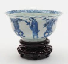 518 518 A Chinese blue and white small bowl of fluted form with flared rim, the exterior painted with