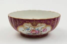 610 608 A Royal Worcester bowl by William Ricketts the interior painted with a group of pears, grapes and flowers against a woodland bank, signed, pink printed mark, date code for 1926, 20cm
