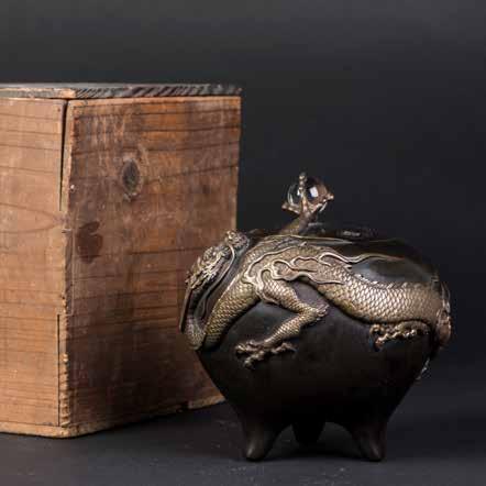 At the head of the vessel, the dragon s claw clutches a perfect orb of clear glass. With a Japanese wood box. Height 6.