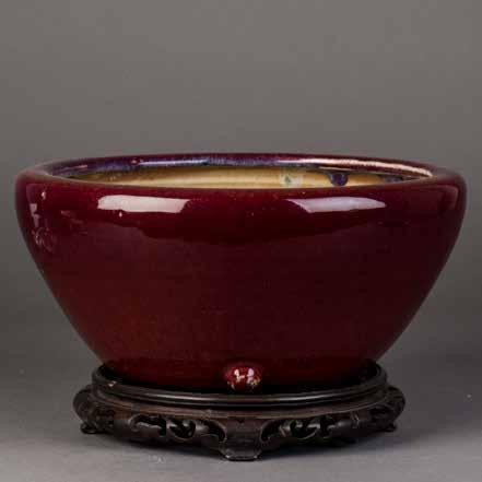 Height 5 Diameter 10 $500-800 1093 清窑变釉笔筒 A CHINESE COPPER RED GLAZED BRUSH POT Of cylindrical form, even glaze overall,