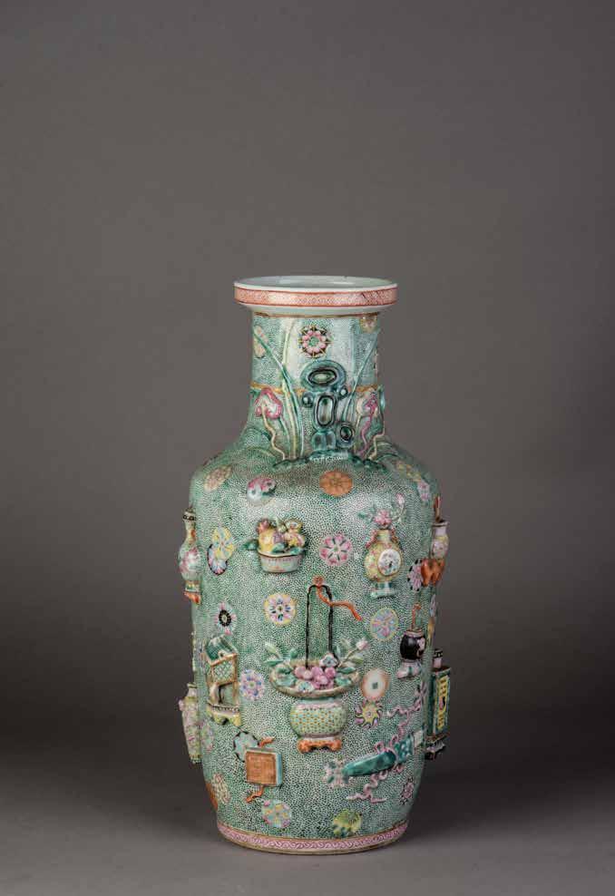 1137 十九世纪粉彩雕瓷博古纹棒槌瓶 A FAMILLE ROSE RELIEF DECORATED ROUKEAU VASE The body, shoulder and neck exquisitely enameled and carved in high relief with vases, censers,