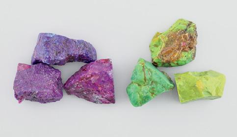 Figure 1. The 15 treated turquoise cabochons examined for this study are divided here into veined and unveined (or minimally veined) varieties that are purple to purple-pink (11.82 21.