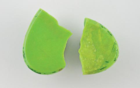 Figure 7. The veins or matrix in the turquoise appear to consist of a bright golden yellow material containing fragments with a brassy color resembling pyrite/marcasite (left).