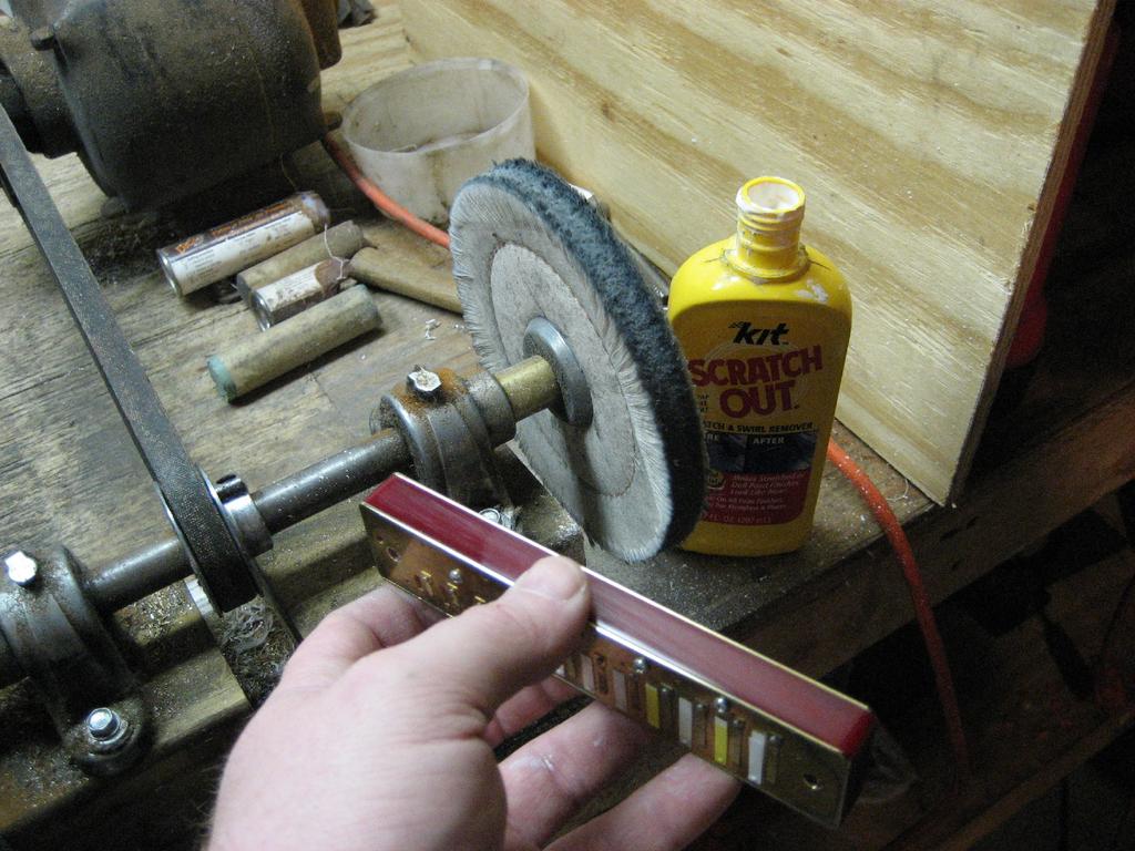 Here you can see I'm using a loose buffing wheel and Scratch Out by Kit. I have found this to be a really good buffing compound on these combs as it's meant to be a scratch remover for plastics.