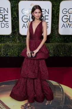 Coleman ( K.C. Undercover ) in Yoko London dripping Tahitian black pearls and black diamonds atop her rich burgundy Marchesa gown with