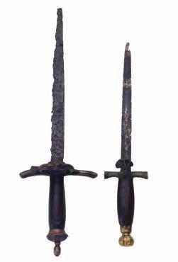 292 293 292 A COMPOSITE DAGGER, CIRCA 1540, DUTCH OR GERMAN in excavated condition, with single-edged blade, iron hilt with slightly up-turned quillons (a forward branch missing), side-ring