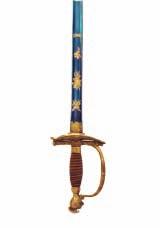 punched with gold stars, and Turks heads, in its original leather-covered wooden scabbard with steel mounts, suspension belt and belt clip en suite with the hilt (the chain replaced, steel parts worn