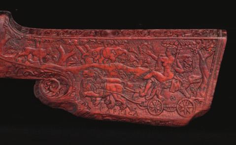 371 371 A FINELY CARVED PORTION OF A WHEEL-LOCK GUN STOCK BY JOHANN GEORG MAUCHER, MID-17TH CENTURY decorated with exotic beasts and the seated figure of Africa on her chariot on the cheek-piece, a