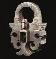 sprung mechanism retained by engraved plates, and stamped with the letters MM at the front, fitted with a small handle at each end, complete with an associated key (pitted throughout) 19.