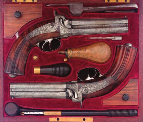 450 450 A PAIR OF SAXON OVER-AND-UNDER RIFLED PERCUSSION PISTOLS BY JANECK IN DRESDEN, CIRCA 1840 with signed etched twist sighted barrels, octagonal breeches and muzzles, rifled with eight grooves,