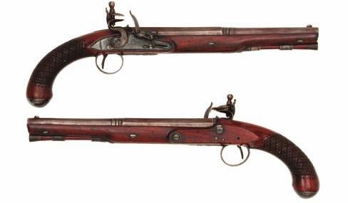 83 83 A PAIR OF FLINTLOCK PISTOLS BY JOVER, LONDON, CIRCA 1780 with earlier Continental browned sighted two-stage barrels, struck with a mark, BN within a rectangle, over the breech, gold-lined