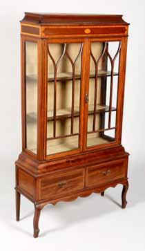 681-760 Furniture 141 690 Edwardian inlaid mahogany display cabinet with twin astragal glass doors above a pair of base drawers.