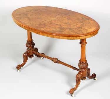 stretcher table, oval shaped top on turned supports and cross stretchers,
