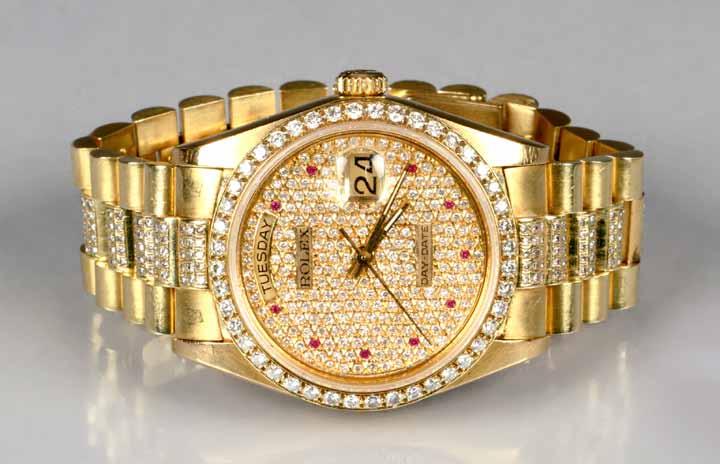 4 grams 69 Gents 18K gold day-date Rolex wrist watch, pave diamond dial, with rubies to hours, brilliant cut diamond set Bezel, self