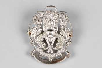 marquise cut diamond surrounded by emerald cut rubies and diamond shoulders, retailed by Edward Diamond Merchants,