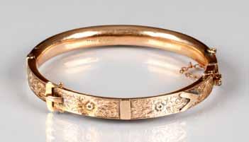 Total weight 23 grams, brooch 38mm x 38mm 180-240 (+ 21% BP*) 106 Boxed Victorian ladies 9 carat gold stiff bangle with engraved scroll work