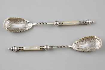 1908. 27cm long 18cm high 214 Pair of Mother of Pearl handled electro plated silver berry spoons, chased scroll work
