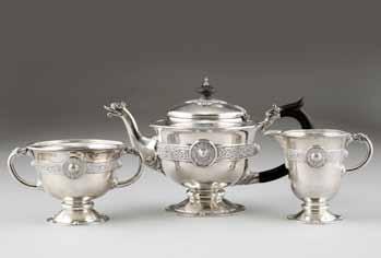 300-400 (+ 21% BP*) 221 Irish three piece silver tea service, raised on circular feet decorated with a