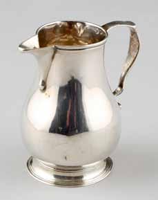 8cm high 223 George III silver sparrow beak cream jug, baluster form, Assay marked London 1731. 2ozs. 7.