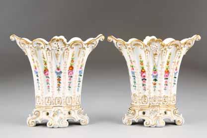 14cm high 292 Pair of Continental vases, fluted bodies with flared scallop rim supported on
