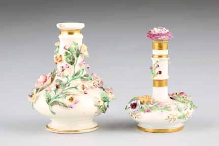 handles, applied flowers around two hand painted floral sprays with gilt enrichments supported on four