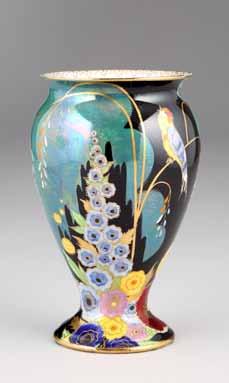 26cm high 100-150 (+ 21% BP*) 312 Carlton ware vase, baluster form, floral pattern with a singing bird, black factory mark, 3562