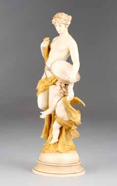 28cm high 60-90 (+ 21% BP*) 327 Austrian ceramic figure ornament, a young maiden with cupid marked W &