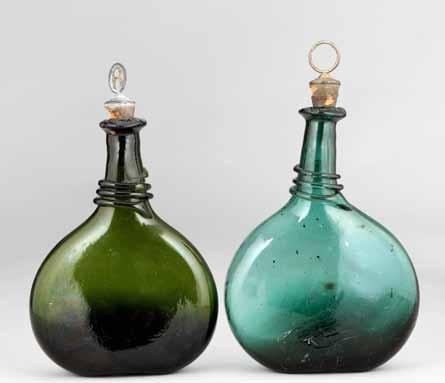 28cm high 449 Two 18th Century flat sided glass bottles of squat form with triple neck tubes, one