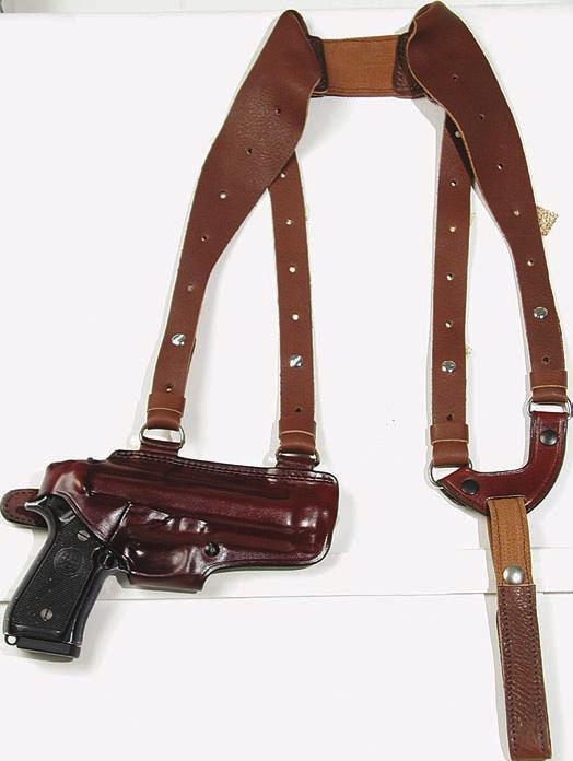 A sewn on belt loop will permit strong side carry. A slot is cut into the belt loop to accommodate a tie down. The double side harness allows easy carry and balance.